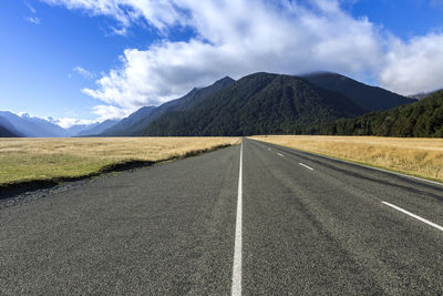 Surface level of road against mountain range