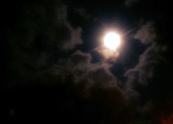 Low angle view of cloudy sky at night