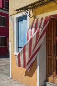 Fluttering curtain on a italian house entrance