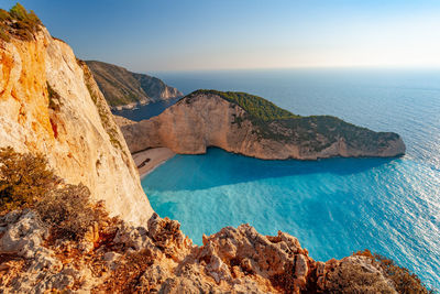 Panoramic view of sea and mountains against sky