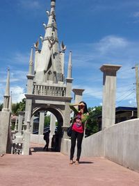 Full length of woman standing against clear sky