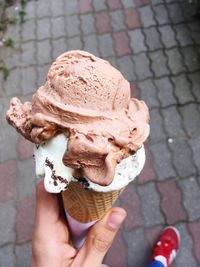 Hand holding ice cream cone