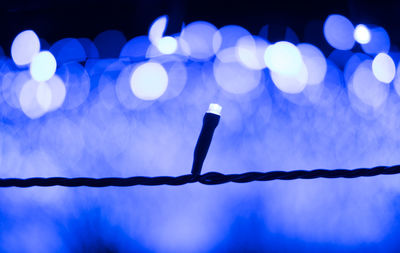 Close-up of illuminated lights at night