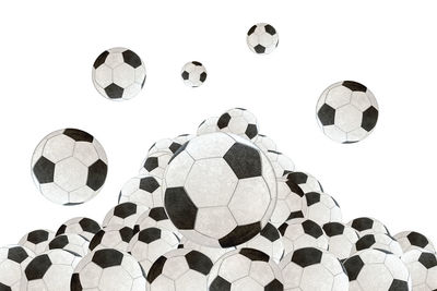 Low angle view of soccer ball against white background