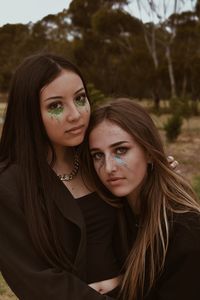 Portrait of beautiful girls standing outdoors