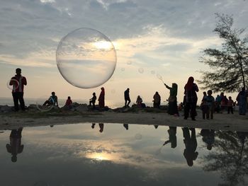 Reflection of people in water