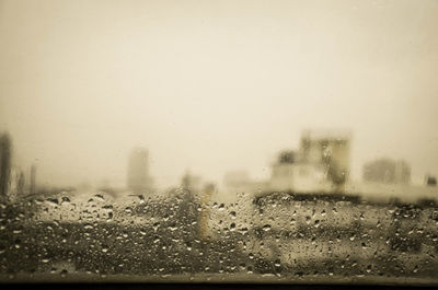 Raindrops on glass window during rainy season