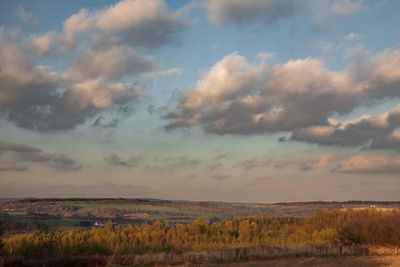 Scenic view of field against sky during sunset