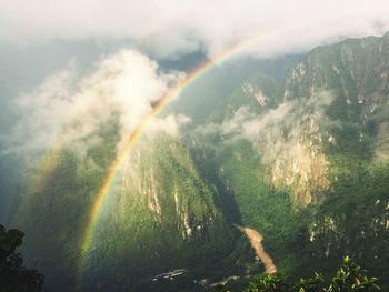 Scenic view of rainbow over landscape