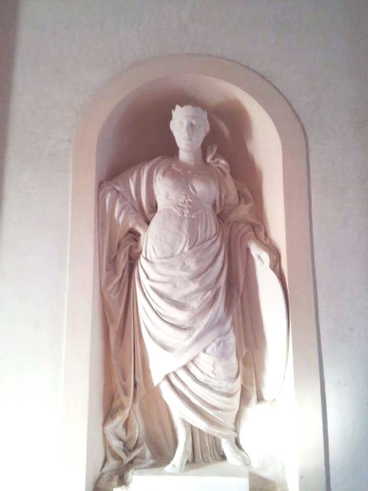 LOW ANGLE VIEW OF STATUE OF BUDDHA