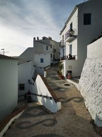 Houses in city against sky