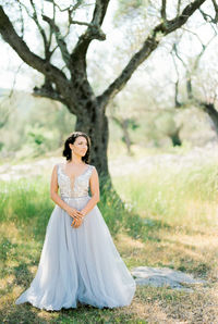 Young woman standing on field