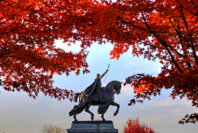 Low angle view of statue against sky