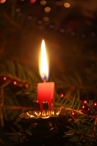 Close-up of illuminated candle during christmas