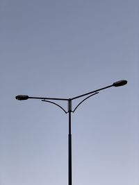 Low angle view of street light against clear sky