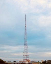 Low angle view of communications tower against sky