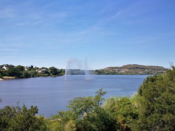 Scenic view of landscape against blue sky