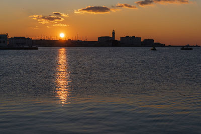 Last twilight lights. sunset in trieste. colors on the water. italy