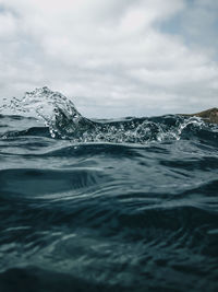 Surface level of sea against sky