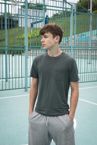 Portrait of young man exercising in gym