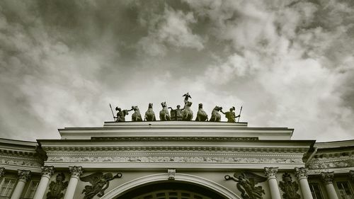 Low angle view of statue against cloudy sky