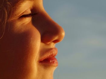 Close-up of woman against sky