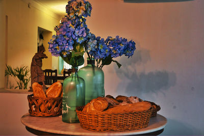 Close-up of flowers in basket on table at home