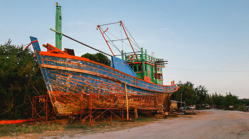 Abandoned boat against clear sky