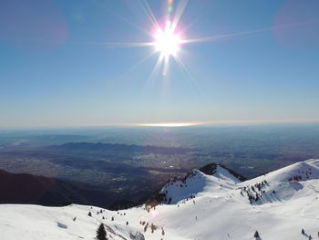 Scenic view of snowcapped mountains against sky