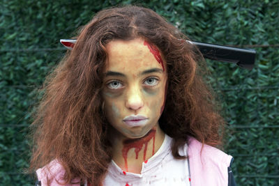 Close-up portrait of girl with painted face