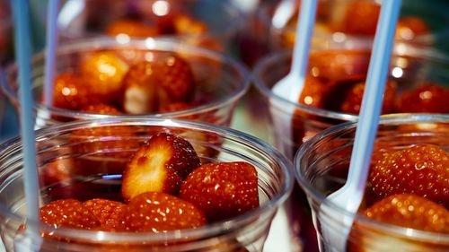 Close-up of strawberries in glass containers