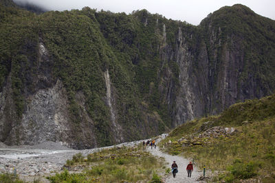 People against mountains