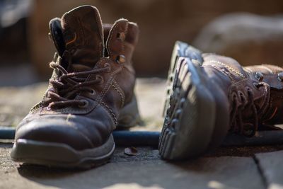 Close-up of shoes on land