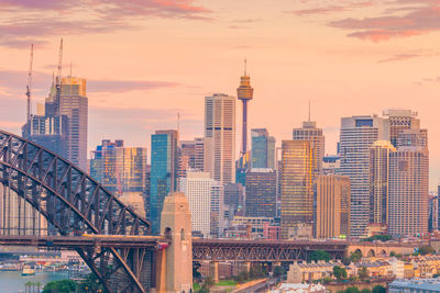 Modern buildings in city at sunset