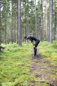 Tired runner in forest
