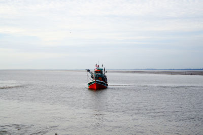 Boat on sea against sky