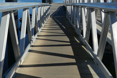 High angle view of railings on footpath