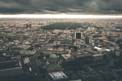 Aerial view of cityscape against sky