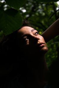 Close-up portrait of young woman with eyes closed