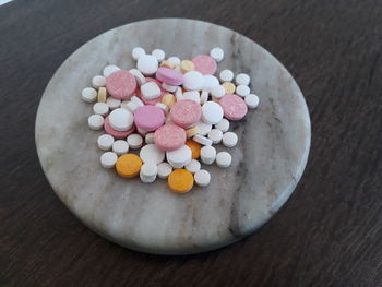 High angle view of multi colored candies on table