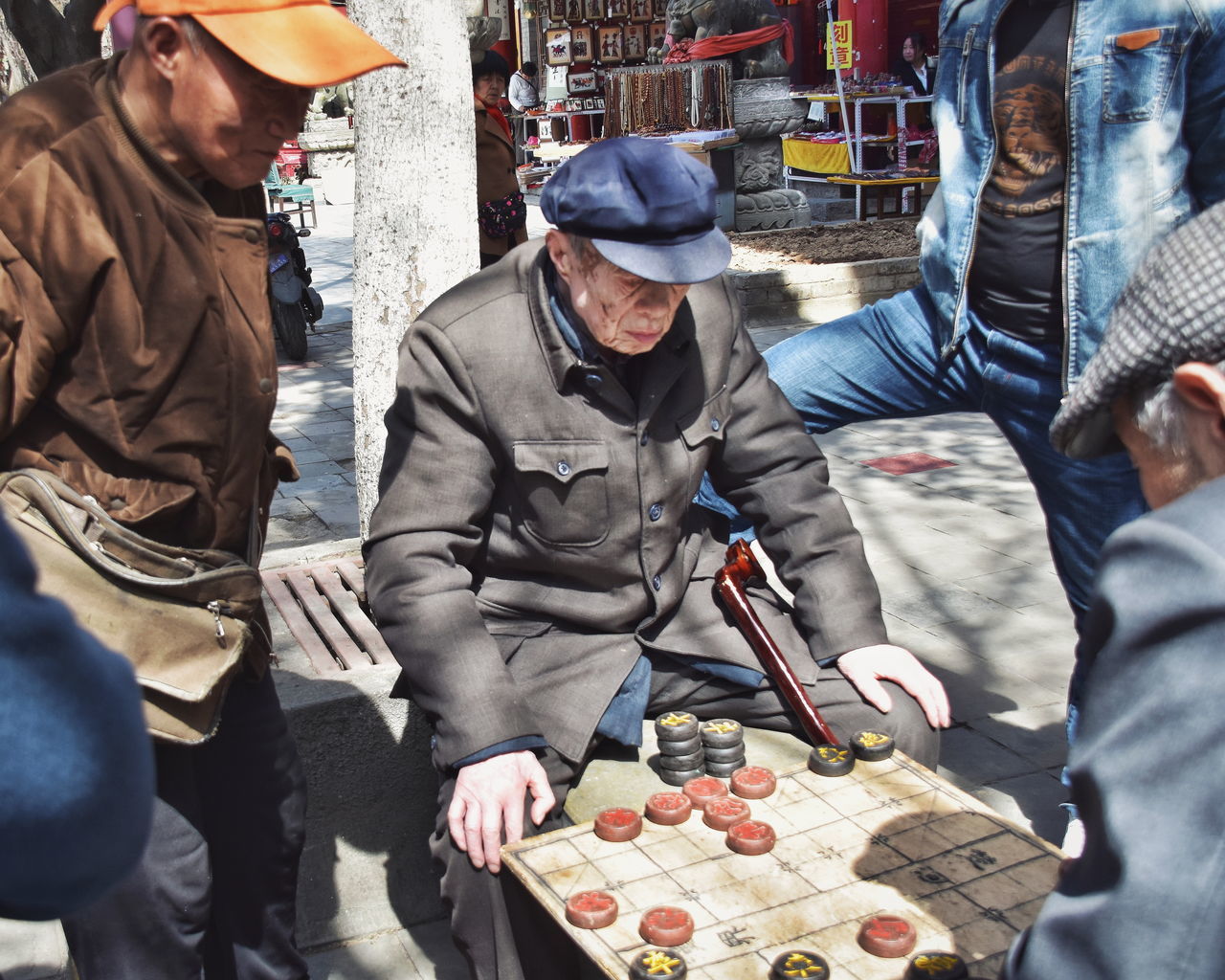 men, group of people, adult, person, clothing, day, occupation, city, food, footwear, winter, business, hat