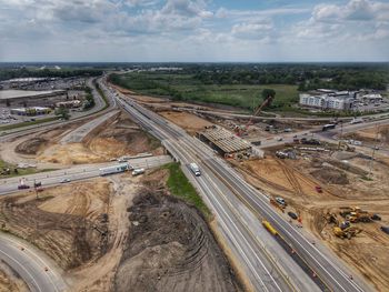 High angle view of highway in city against sky