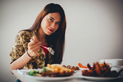 Portrait of young woman in plate