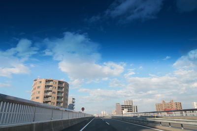 Exterior of buildings in city against blue sky