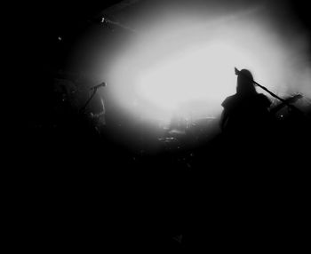 Low angle view of people at night