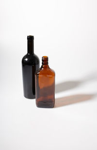 Close-up of bottles against white background