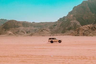 Car on desert land