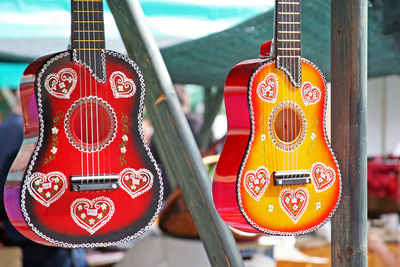 Close-up of guitars for sale