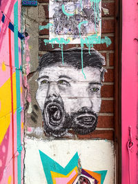 Close-up of man with multi colored graffiti