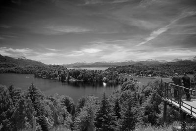 Scenic view of river with mountains in background